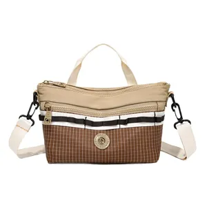 Casual women crossbody bag, stylish plaid canvas shoulder bag with top handle and zippers.
