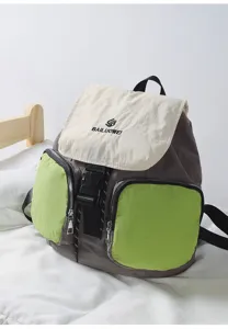 Detailed view of casual multi-pocket backpack with contrast flaps and secure zipper.