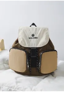 Casual multi-functional college laptop backpack with contrasting color front pockets and flap.
