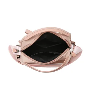 Pink women crossbody shoulder bag, stylish commuter handbag with top handle and large capacity.