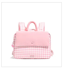 Pink white checkered casual backpack detail showing front flap and handle design for daily use.