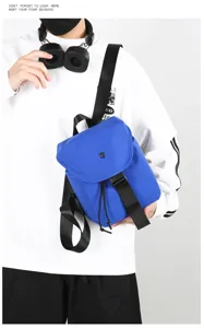 Detail shot of the blue grid mini backpack, featuring durable straps and secure drawstring close.