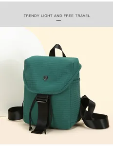 Green grid small backpack, casual fashion commuter travel bag with black straps and buckle closure.