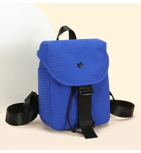 Stylish blue grid mini backpack with flap, buckle and drawstring for modern daily commuting.