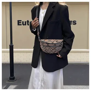 Detailed shot of trendy snakeskin pattern crossbody dumpling bag, stylish outdoor street wear.
