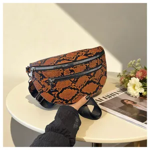 Detailed view of fashionable orange snakeskin pattern fanny pack with dual zippers and strap.
