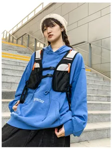 Details of tactical chest bag and hoodie, multi-pocket harness vest for outdoor sports.