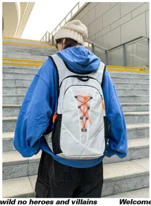 Detailed view of lightweight outdoor backpack with bungee cord on stone steps in urban setting.