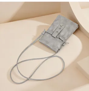 Grey minimalist crossbody phone bag small pouch mini shoulder bag with adjustable strap.