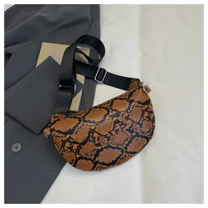 Brown snake print crossbody dumpling bag with wide black nylon strap for women fashion daily.