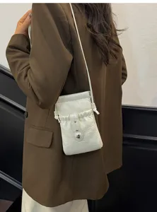 Minimalist white drawstring mini crossbody phone bag, casual chic pouch for daily outfits.