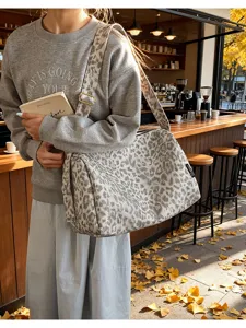 Leopard print canvas shoulder bag scene detail, casual autumn style large capacity tote.