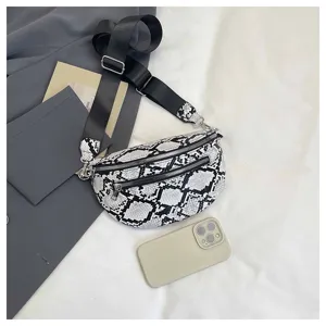 Snake print sling bag, stylish crossbody dumpling bag with wide strap for casual daily use.