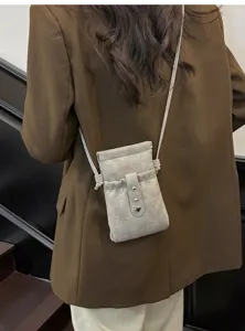 Detail view of the mini grey crossbody phone bag, featuring chic style and compact everyday design.