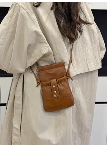 Brown PU leather mini crossbody phone bag with drawstring closure and heart decor style