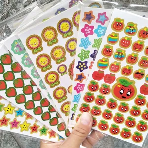 Cute cartoon reward stickers featuring smiling fruits, flowers, and stars for kids crafts.