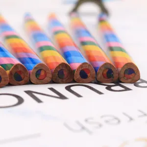 Colorful rainbow pencils with multi-color cores, triangular wooden design for kids drawing art.