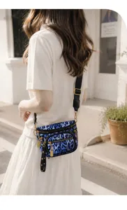 Stylish blue leopard print crossbody chest bag worn by model outdoors, detailed view.