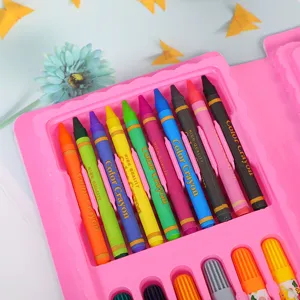 Close-up details of colorful crayons and watercolor pens inside a pink stationery gift box set.