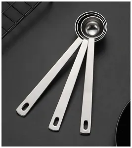 Stainless steel long handle measuring spoons set for coffee powder and home baking.