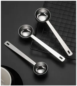 Stainless steel long handle measuring spoon detail shot, perfect for coffee and baking powder.