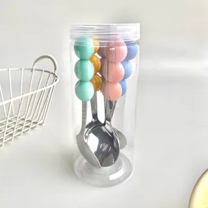 Macaron color three-bead stainless steel spoon and fork set with clear portable storage barrel.