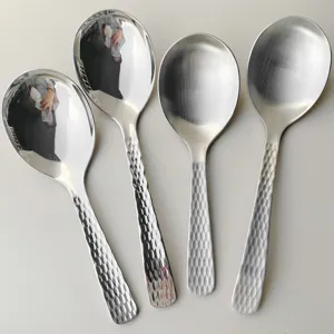 Stainless steel serving spoons with hammered handle, mirror and brushed finish detail view.