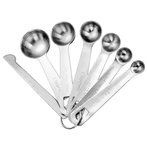 Ensemble de cuillères à mesurer en acier inoxydable avec règle pour la pâtisserie et la cuisine.