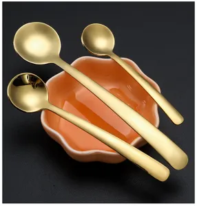 Stainless steel mini golden coffee spoons set with ceramic flower dish for kitchen seasoning.