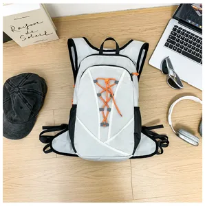 Detail view of a lightweight outdoor sports vest backpack with orange drawstrings and black trim.