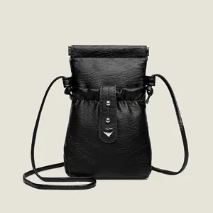 Black faux leather crossbody phone bag with drawstring closure and silver heart charm.