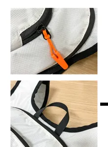 Lightweight outdoor sports backpack detail showing durable zipper pull and strap design.