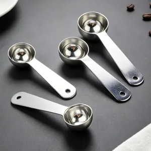 Stainless steel measuring spoon detail shot, perfect for coffee beans and baking kitchen tools.