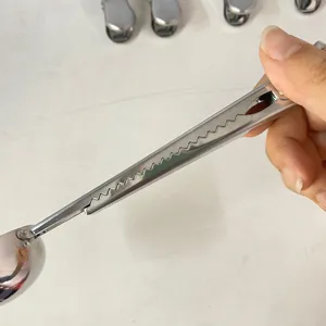 Stainless steel measuring spoon with clip handle for coffee beans and baking kitchen use detail shot