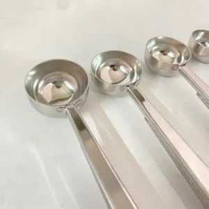 Stainless steel measuring spoon detail view, durable kitchen baking tool with clip.