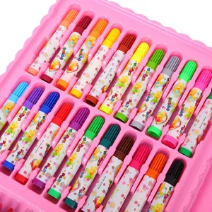 Detailed shot of colorful children's water color markers arranged in a pink storage tray.