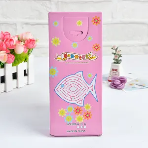 Close up detail shot of pink children stationery packaging box featuring cute fish maze pattern.