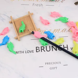 Cute silicone dolphin fish pencil grip writing posture corrector for kids students stationery.