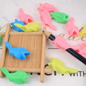 Silicone dolphin pencil grip detail, soft ergonomic correction tool for kids handwriting posture.