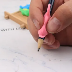 Ergonomic silicone pencil grip for kids handwriting posture correction training tool and pen.