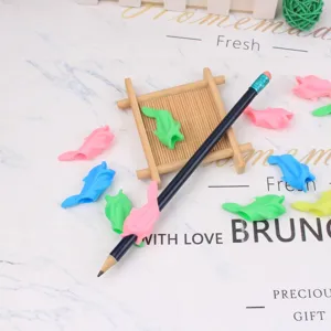 Silicone dolphin pencil grip detail, soft rubber writing posture corrector for kids and students.