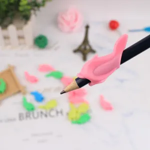 Pink silicone pencil grip for kids cute dolphin shape writing posture corrector tool