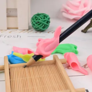 Silicone pencil grip detail view, ergonomic writing posture corrector in multiple colors.