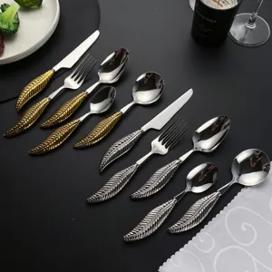 Stainless steel western cutlery set with creative feather handle for dining table details.