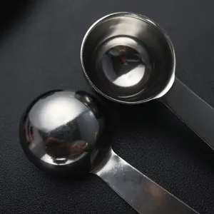 Stainless steel measuring spoon detail, durable kitchen baking coffee bean powder scoop tool.