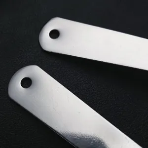 Stainless steel measuring spoon detail view, precise baking and kitchen tool for powder.