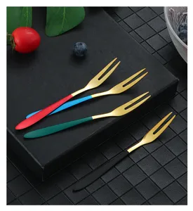 Stainless steel fruit forks set with colorful handles, perfect for desserts and cakes.