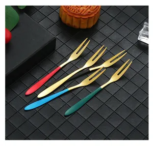 Stainless steel fruit forks set with colorful handles, perfect for desserts and cakes.