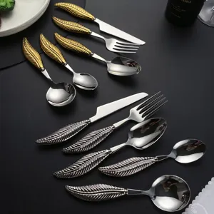 Stainless steel flatware set with creative feather handle design, gold and silver cutlery for dining.