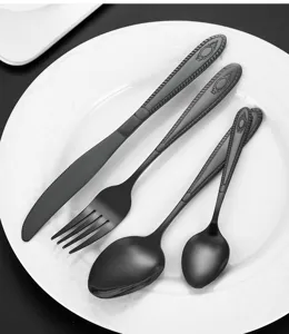 Stainless steel flatware set in black, includes knife fork spoon for kitchen dining.